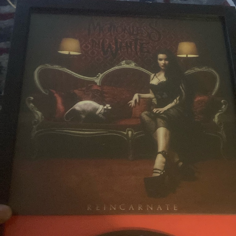 Framed and autographed Motionless In White Reincarnate album on vinyl.